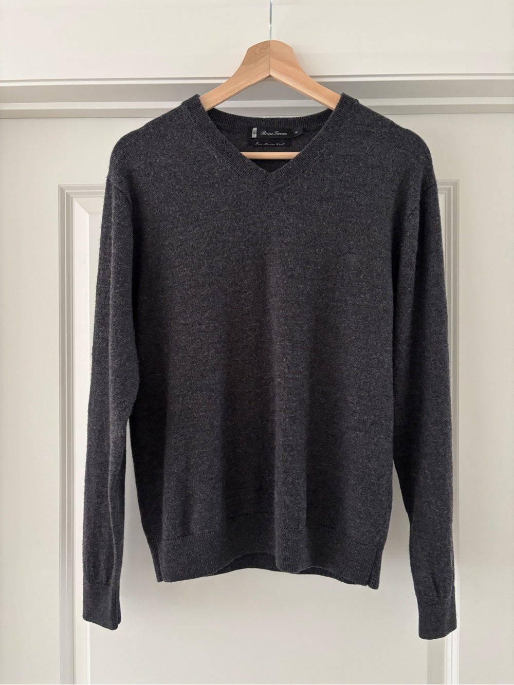 100% extra fine merino wool v-neck knit by Bruno Ferraro